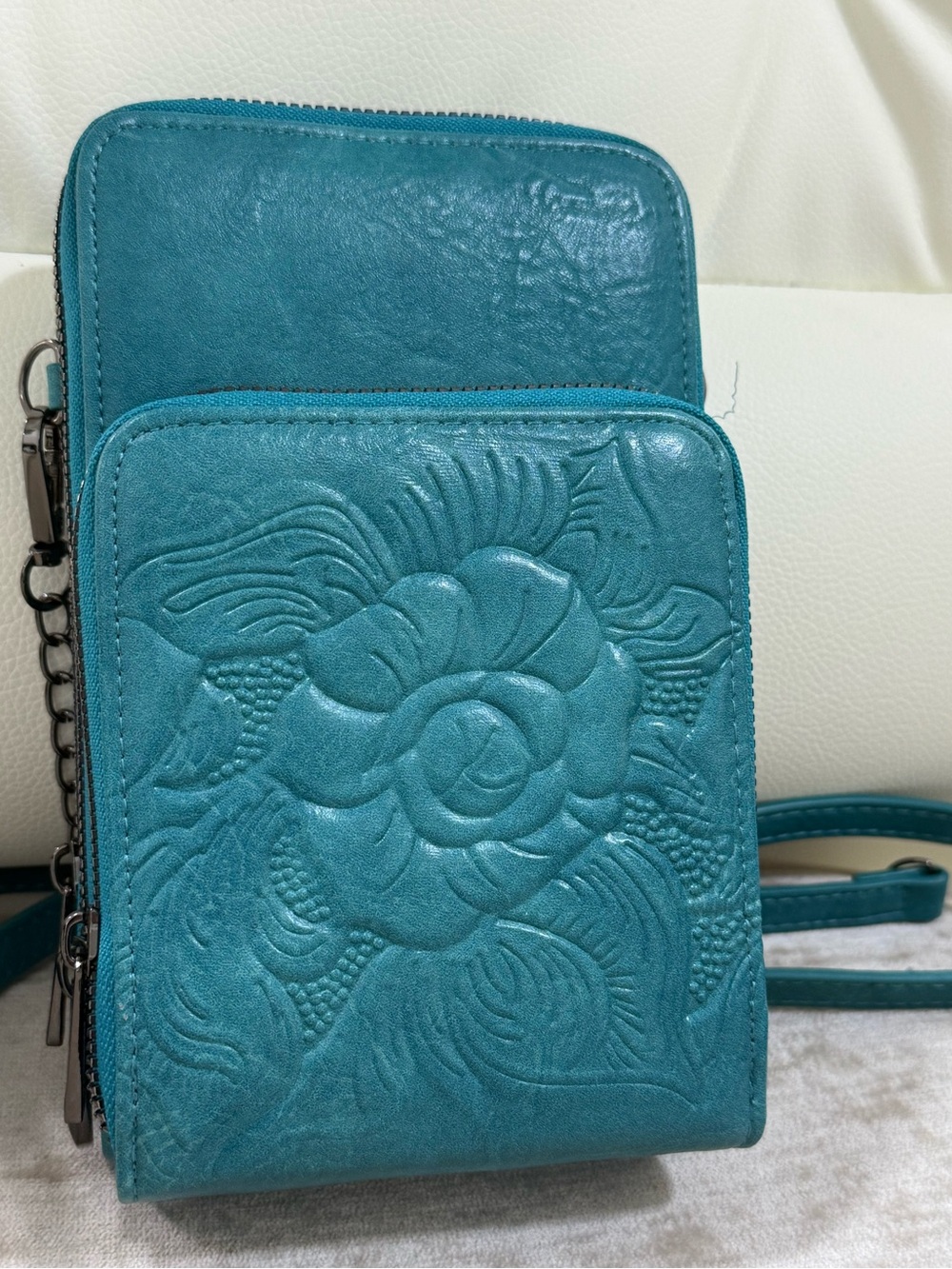 Alyssa crossbody bag in teal floral design embossed brand new many pockets